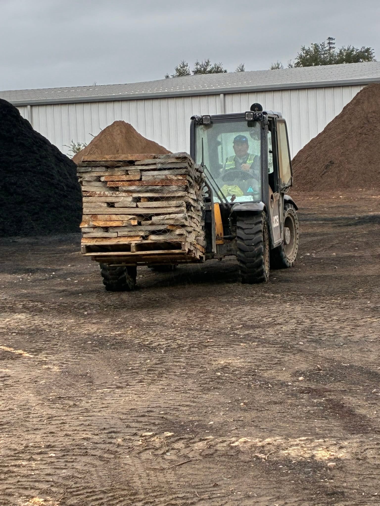 Loader moving landscape materials at the yard