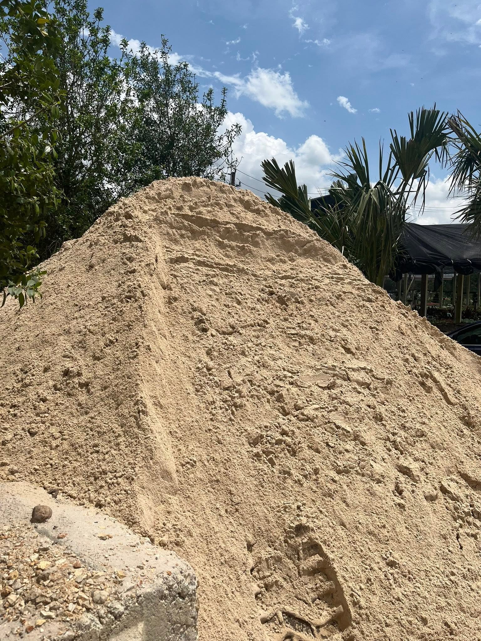 Bulk sand material shown at the yard