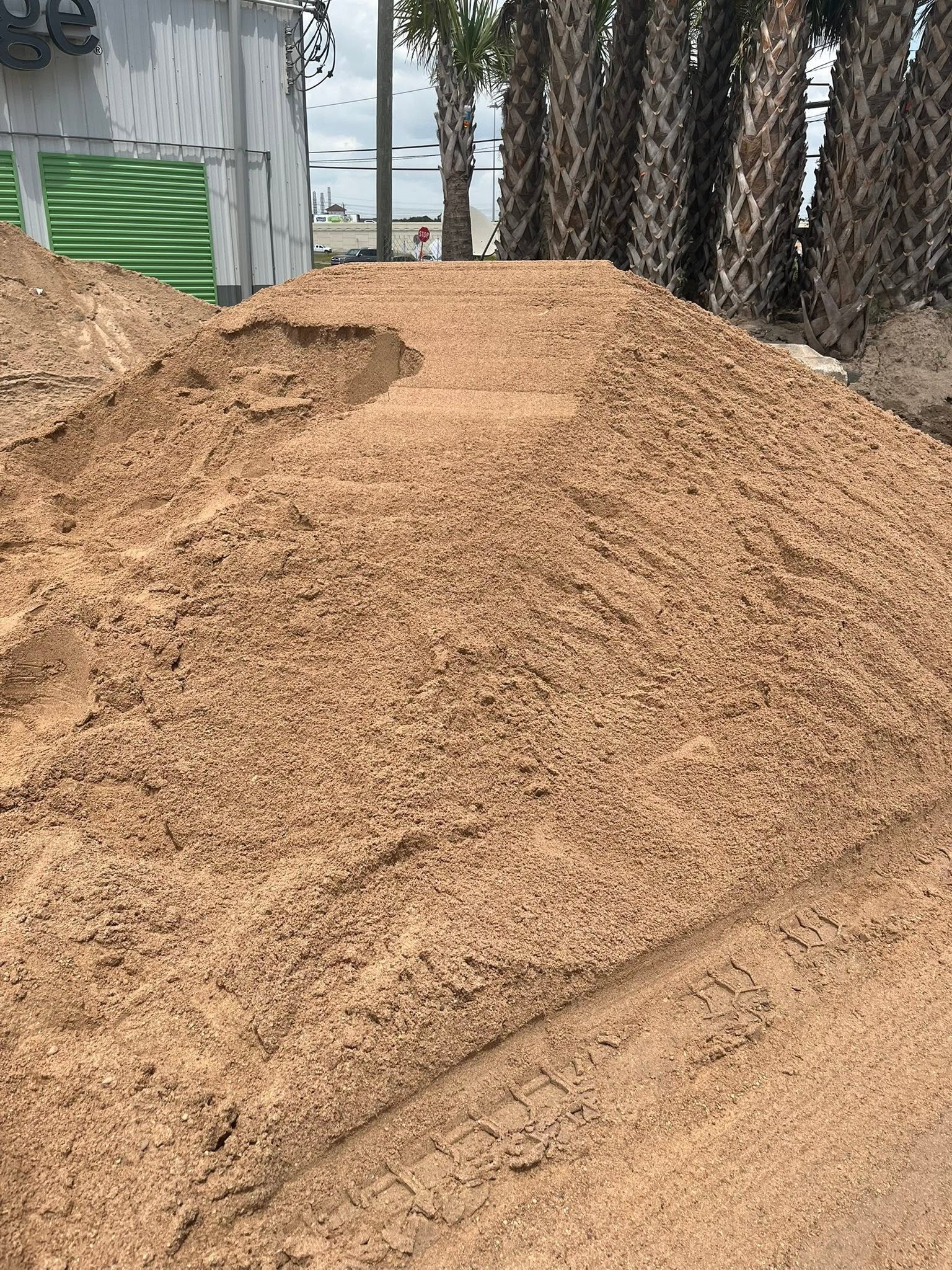 Large sand stockpile at the supply yard
